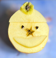 Smile face from fresh apple. Happy emoticon of delicious apple slices snack, close up of an apple.