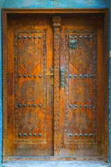 Close up view of an old vintage wooden door on one of the streets of Manama, Bahrain