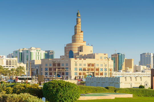 Doha, Qatar- Jan 14 2024, Panoramic view of the Sheikh bin Zaid Qatar islamic cultural center, Fanar, in the foreground a square in palm trees and shrubs, at daytime, Doha, Qatar 