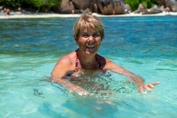 An elderly caucasian woman in La Digue, Seychelles