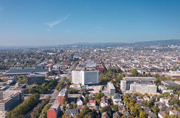 Aerial summer skyline cityscape of Wiesbaden, Hesse, Germany. Wiesbaden Central Station (Hauptbahnhof) on the left. - obrazy, fototapety, plakaty