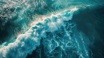 Aerial view of ocean waves with frothy foam