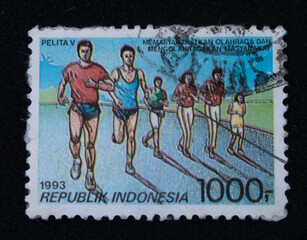 Vintage philatelic stamp with illustration of running sport