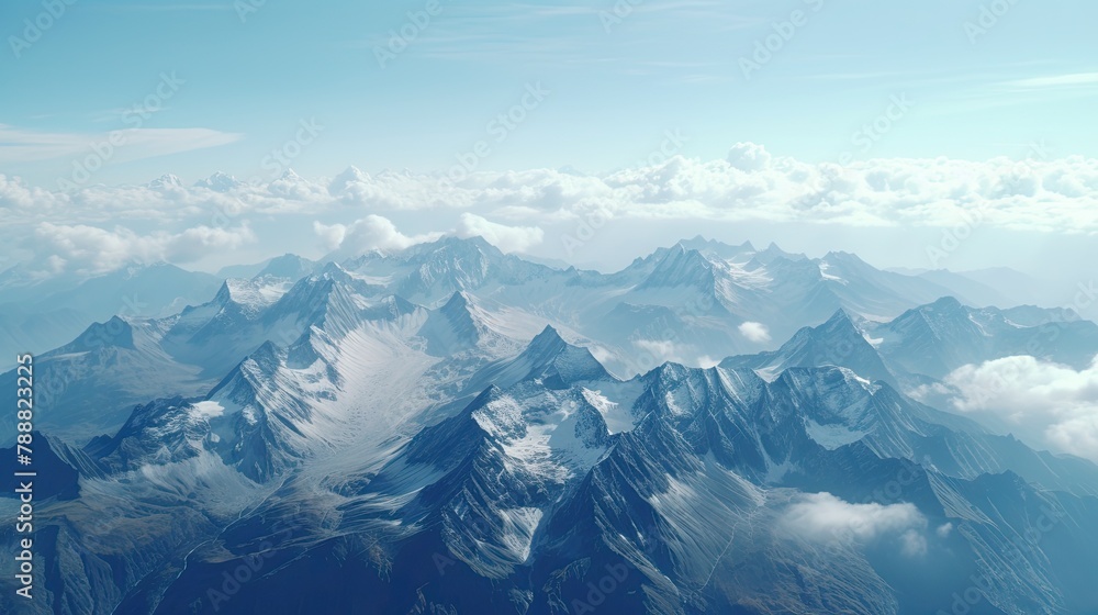 Poster this is an aerial view of a mountain range. the mountains are covered in snow. there are clouds in t