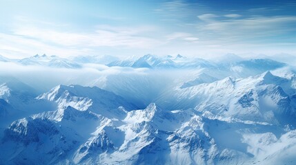 Obraz premium This is a beautiful landscape photograph of snow-capped mountains. The image is taken from a high angle, and the mountains are in the distance.