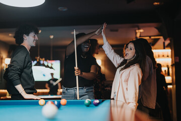 Joy fills the air as friends celebrate a successful pool shot at a lively bar. Their evening out is captured in smiles, laughter, and high fives.