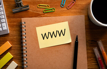 There is sticky note with the word WWW. It is an abbreviation for World Wide Web as eye-catching image.