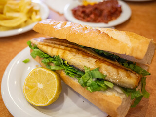 turkish mackerel sandwich on the table of restaurant in istanbul
