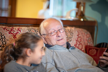An elderly gentleman with his nephew at home - obrazy, fototapety, plakaty