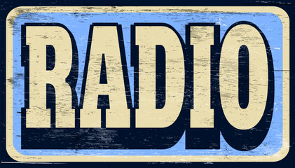 Aged retro radio sign on wood