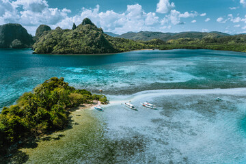 Aerial view of turquoise water and sandbar on tropical Vigan Snake Island, tourist attractions,...