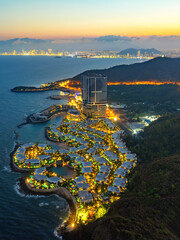 Nha Trang city seen from above in the night with a beautiful stretch of clean sand attracts...