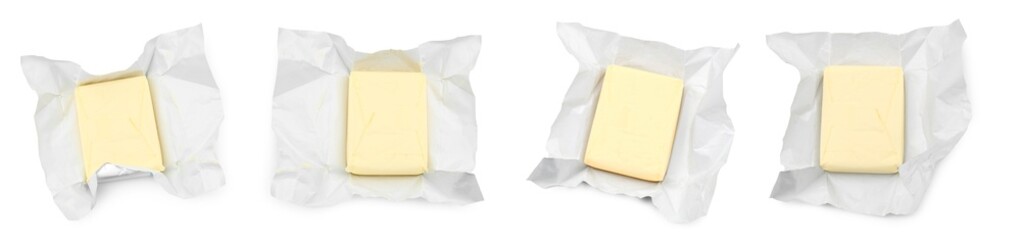 Set with butter in wrapper isolated on white, top view