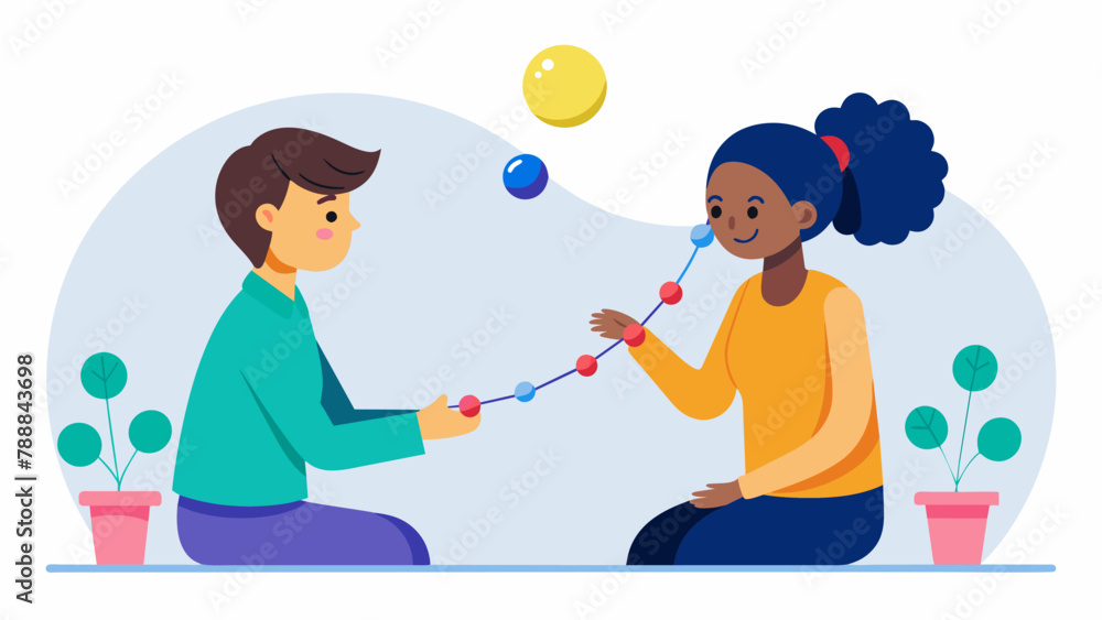 Aufkleber in a oneonone session a client carefully arranges different colored beads on a string each represent
