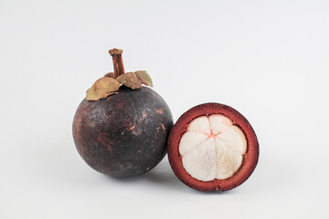 Mangosteen fruit on old white background. The Queen of Fruits, Tropical fruit with sweet juicy...