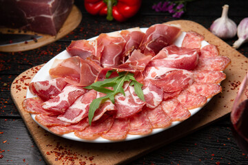 italian dry cured pork meat with spices and herbs.