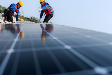 Male workers repair Floating solar panels on water lake. Engineers construct on site Floating solar panels at sun light. clean energy for future living. Industrial Renewable energy of green power.
