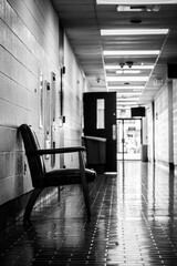 School hall way with chair for students waiting for detention.