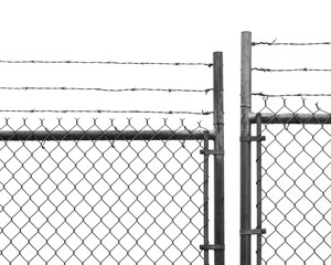 Barb wire on top of a chain link fence black and white