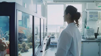 Fotobehang A marine biologist using AI to track sea life, in a clean, ocean-view lab, styled as nautical modern. © Exnoi