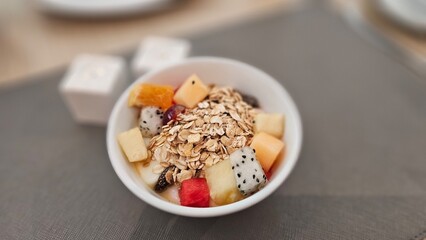 assorted tropical fruits and wholegrains topping on yogurt, breakfast, hotel buffet, easy meal, weight loss program, diet foods, healthy foods