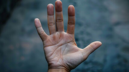 Closeup of a persons hand palm facing outward in a powerful stop gesture symbolizing the strength and determination to resist and fight against human rights violations. . - obrazy, fototapety, plakaty