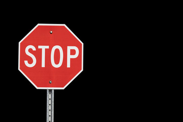 A stop sign isolated on black