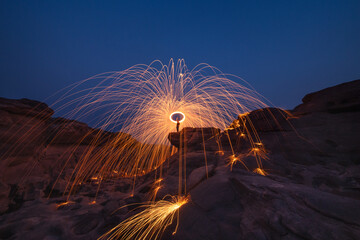 Burning steel wool fireworks, the grand canyon of Thailand (3000 bok) at Sam Pan Bok, Mekong River,...