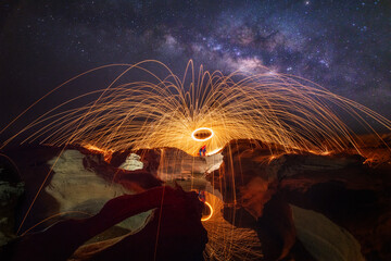 Milky way at Sam Phan Bok ready Burning steel wool fireworks, beautilul stone mountain and a beautiful reflection of the water the grand canyon of Thailand (3000 bok)  Mekong River, Ubon Ratchathani,  - obrazy, fototapety, plakaty