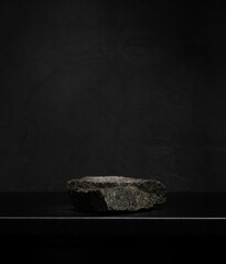 natural stones on a dark background for the podium