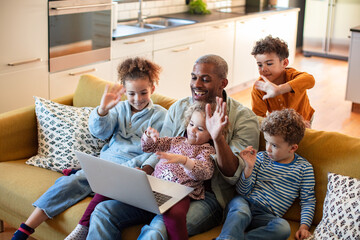 Happy family video calling from home
