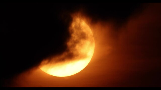 Sunset telephoto shot of sun only  - koh Samui island in Thailand - with covering clouds in front of the sun - real beauty - 1600 mm