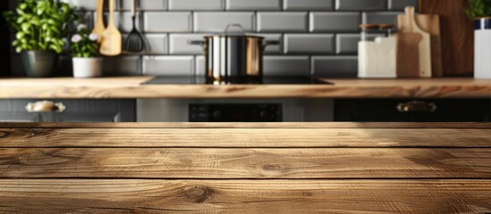 Wooden table surface against a blurred kitchen backdrop, suitable for showcasing products or designing visual layouts.