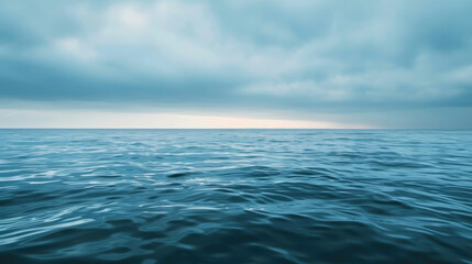 Fototapeta premium Gentle dawn over tranquil sea with minimalist clouds for serene panoramic background