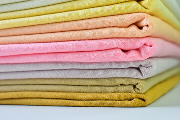 stack of colourful cotton clothes, close up pile of clothing - 788900866