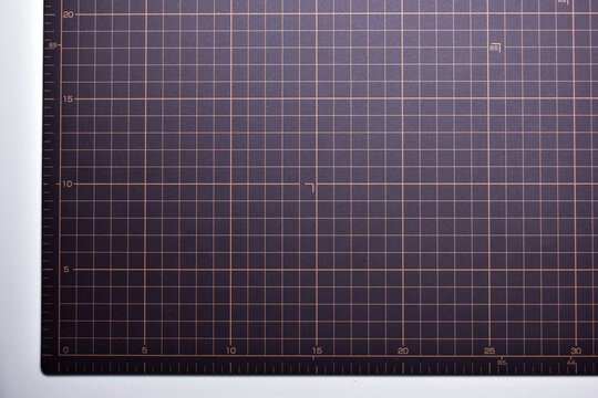 black cutting mat board on white background with line and scale measure guide pattern for object art design, tool equipment of diy craft work