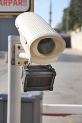 Urban security camera placements near vehicles captured in video footage