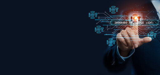 Businessman hand touching virtual graphical interface of Internet of Things (IoT) innovation. Idea for connected solution and smart automation, technology advancement in a global IoT concept.