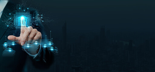 Businessman touching the brain working of Online Banking in the futuristic business and Financial development on interface and digital network connection. © Harsha