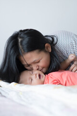 Infant Girl with Asian Mother