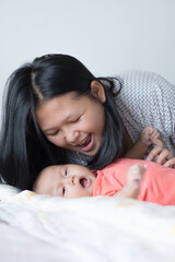 Infant Girl with Asian Mother