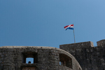 Croatian flag above medieval city wall