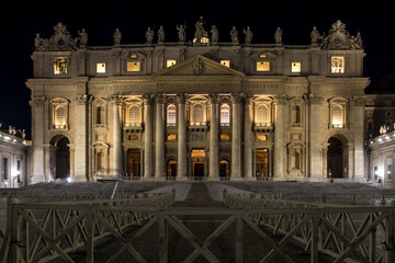 Night view of Saint Peter's Basilica in Vatican City, the papal enclave in Rome, highlighting its...