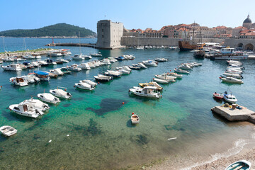 Mediterranean sea and marina outside walls of  medieval walled city of Dubrovnik