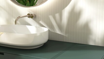 Modern white washbasin on dark green vanity counter countertop in sunlight on cream tile wall...