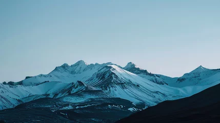 Foto op Aluminium Minimalist mountain landscape with snow peaks under soft dawn light © boxstock production