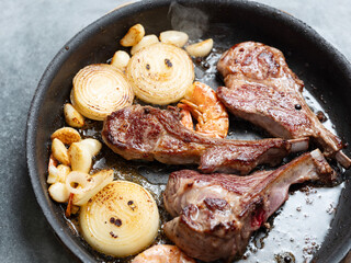 Grilled lamb ribs and vegetables