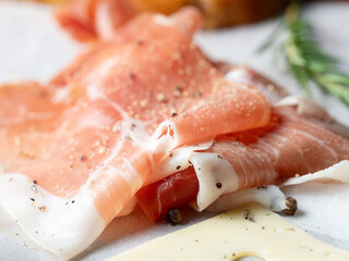 Prosciutto and rosemary on plate	