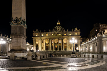 Fototapeta na wymiar Nighttime vista of Saint Peter's Square in Vatican City, the papal enclave in Rome, showcasing the iconic Vatican obelisk at its center, framed by the striking backdrop of St. Peter's Basilica.