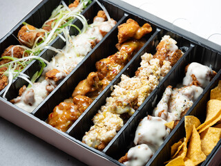 Various types of chicken in packaging containers